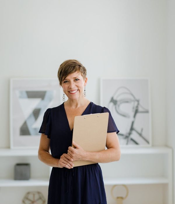 A portrait of a smiling and confident professional coach.